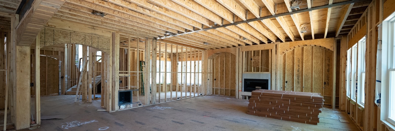 Clean, well-lit framed interior mid-construction, ready for the next stage